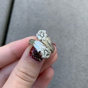 NWOT: SILVER ADJUSTABLE FLOWER RING